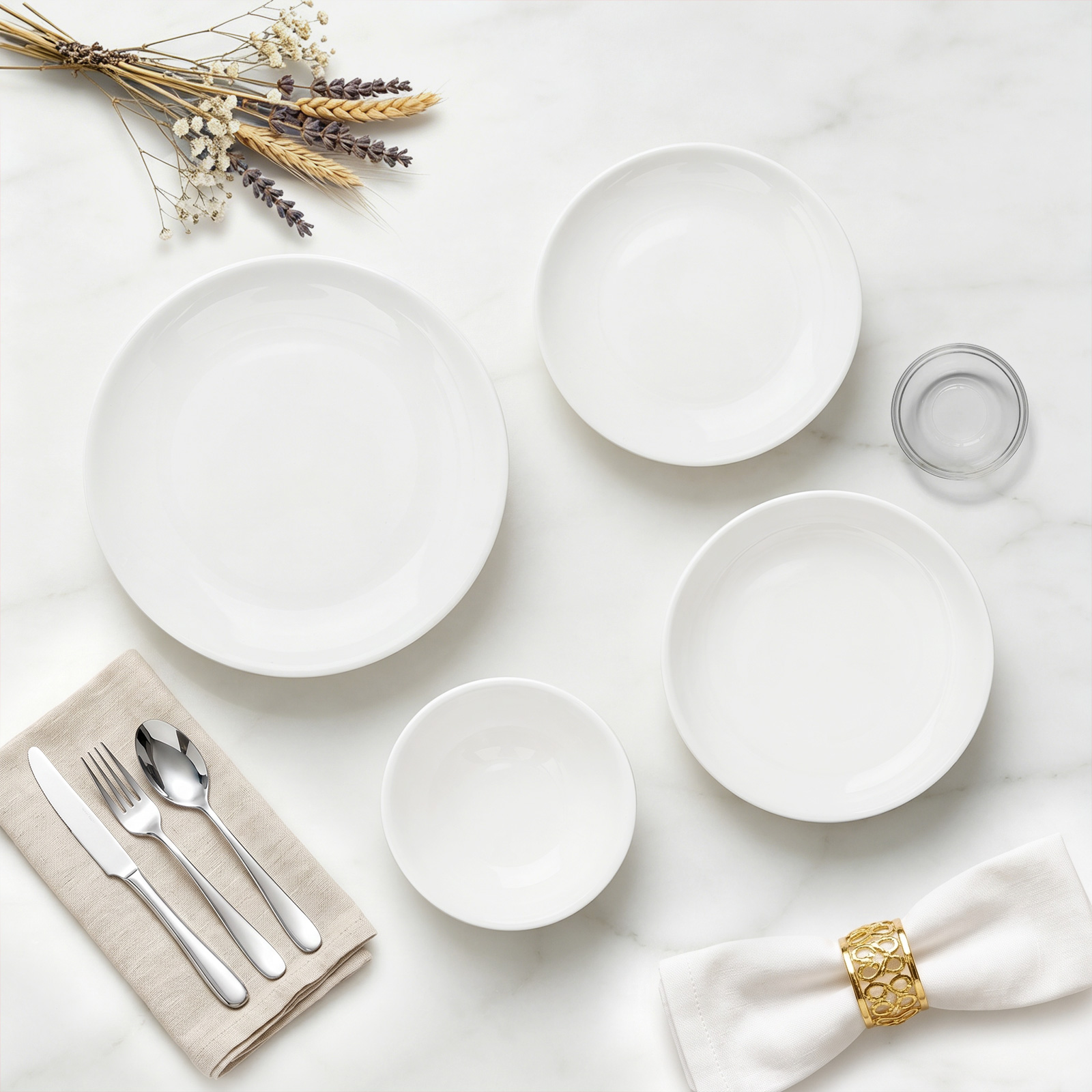 MOONLIT dinnerware styled with linen and flatware